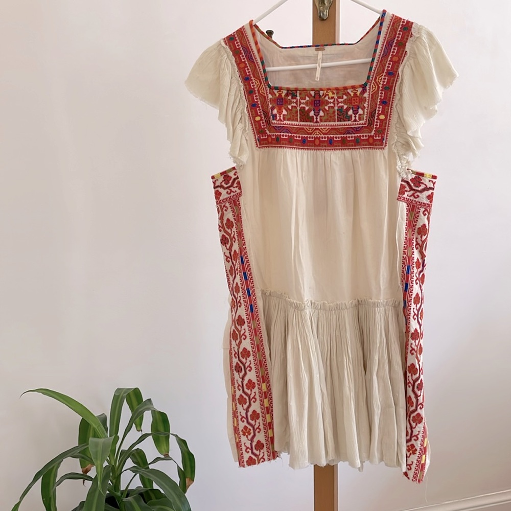 Unique boho Free People dress. Embroidered. Never worn. Size XS.